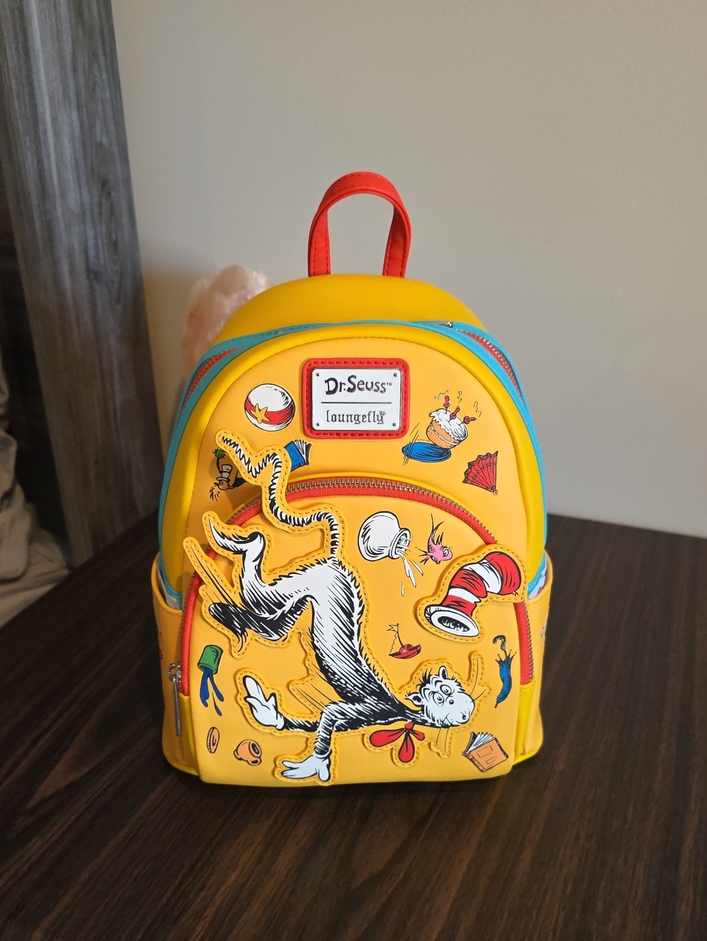 Loungefly Dr. Seuss Yellow Cat in the Hat Mini Backpack with Red & Blue Accents